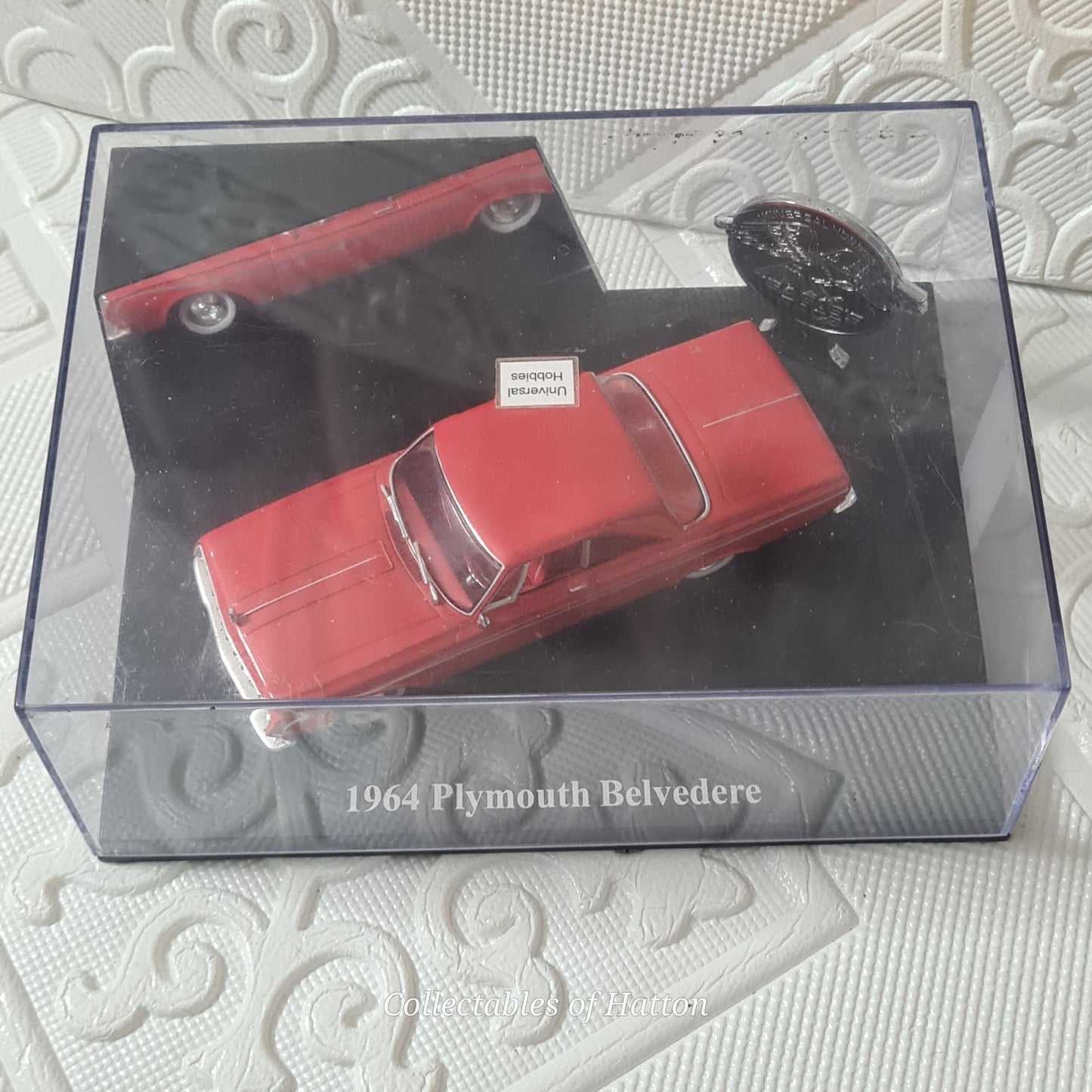 Universal Hobbies 1:43 1964 Plymouth Belvedere red mint case has crack hence cheap
