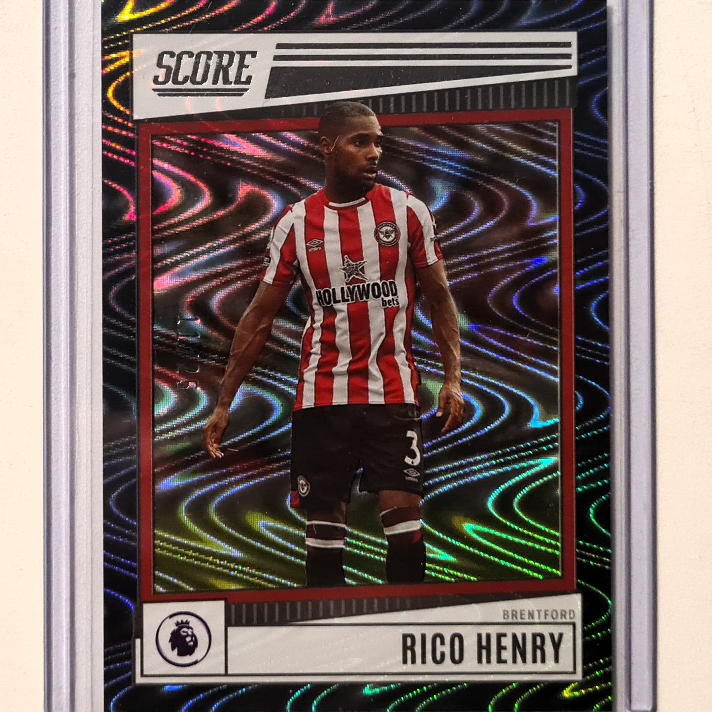 Rico Henry 2022-23 Panini Score premier league Swirl Holo Numbered 11/25 #37 Soccer Football Brentford Excellent/mint Sleeved
