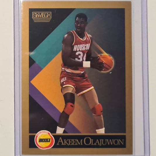 Akeem Olajuwon Hakeem 1990 Skybox inaugural #110 NBA Basketball Houston Rockets ex-mint sleeved
