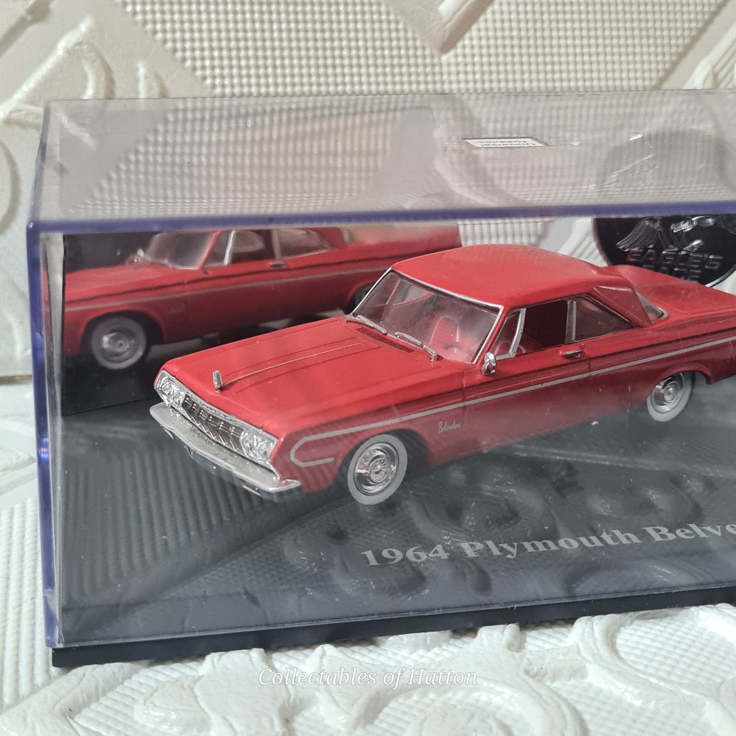 Universal Hobbies 1:43 1964 Plymouth Belvedere red mint case has crack hence cheap