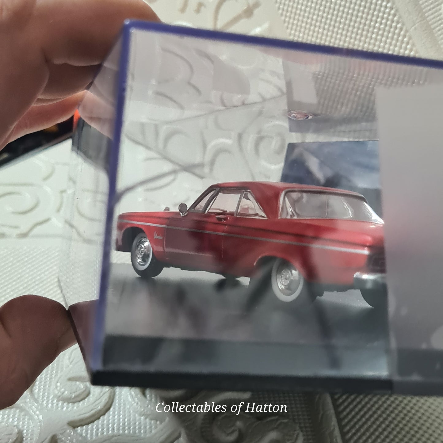 Universal Hobbies 1:43 1964 Plymouth Belvedere red mint case has crack hence cheap