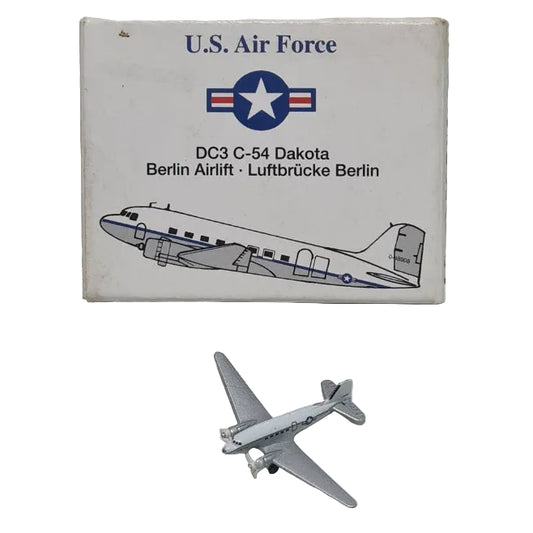 U.S. Air Force matchbox with a model airplane on a textured white surface