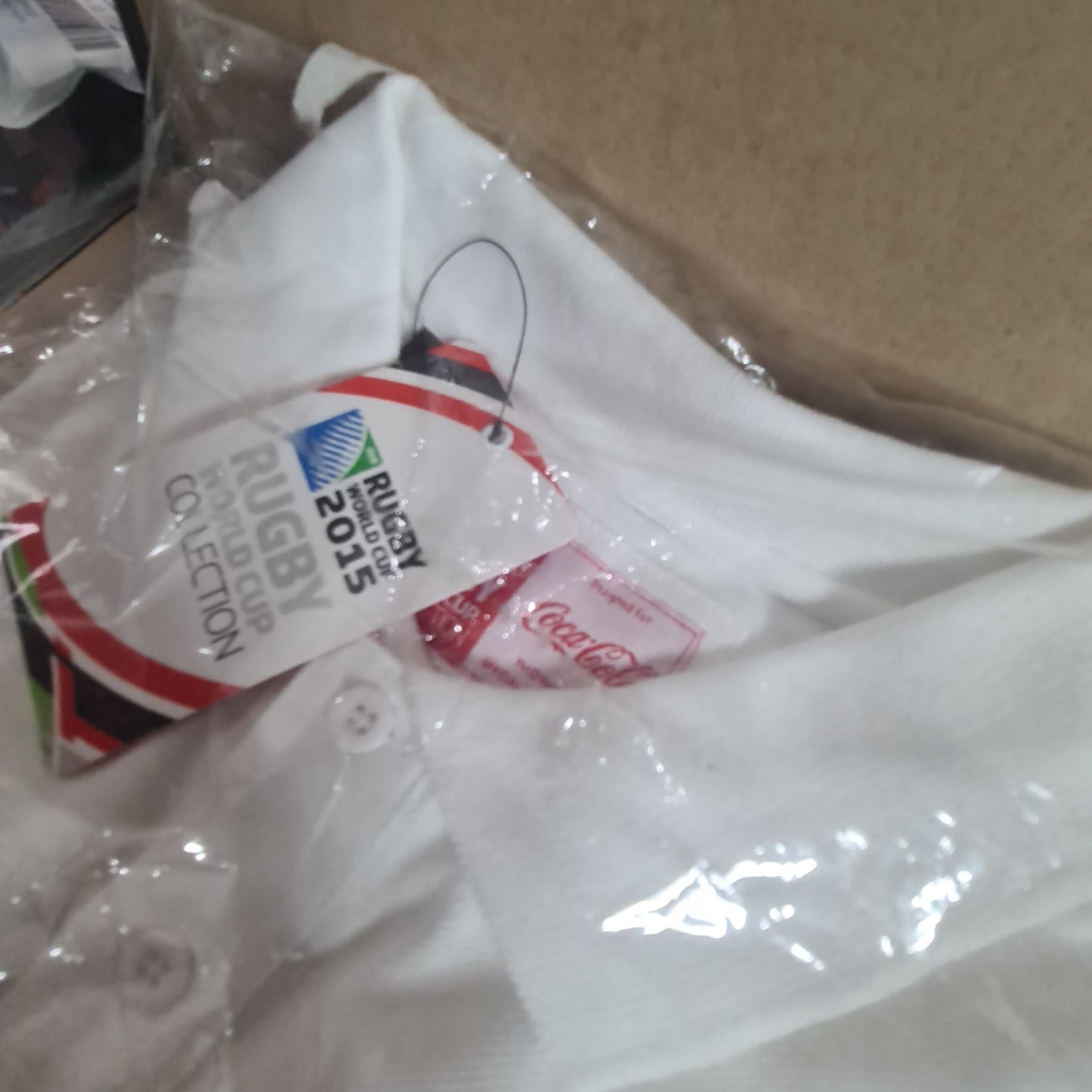 2015 Rugby World cup unused in packet size Small Coca-Cola sponsored polo shirt white